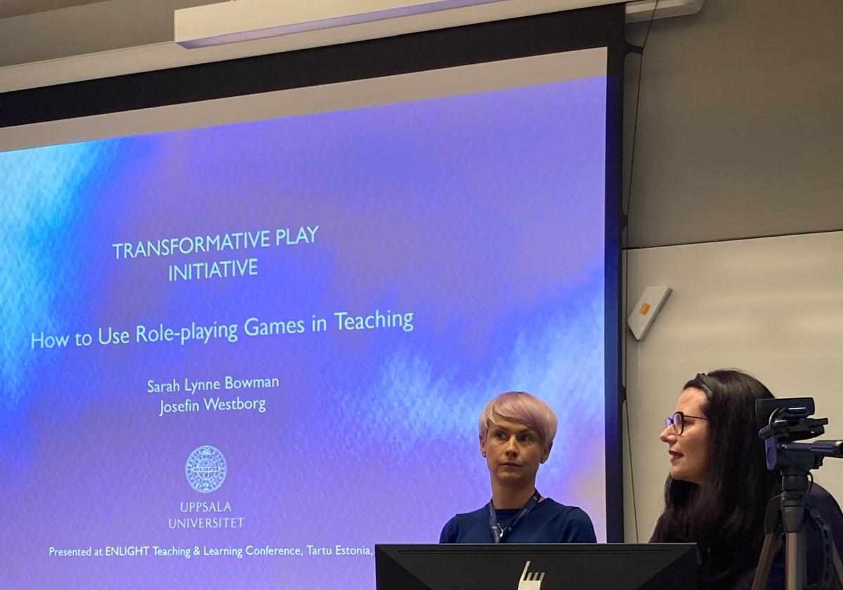 Photo of Josefin Westborg and Sarah Lynne Bowman presenting slides on "How to Use Role-Playing Games in Teaching"